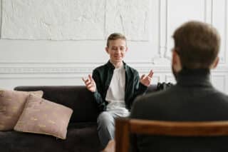 therapist discussing treatment with patient