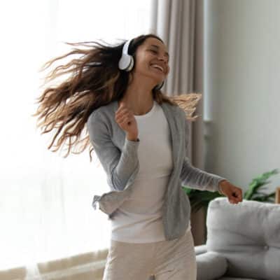 Woman dancing with headphones on